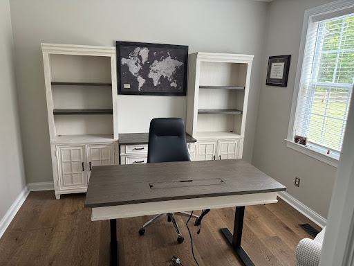 Residential office setup with bookshelves